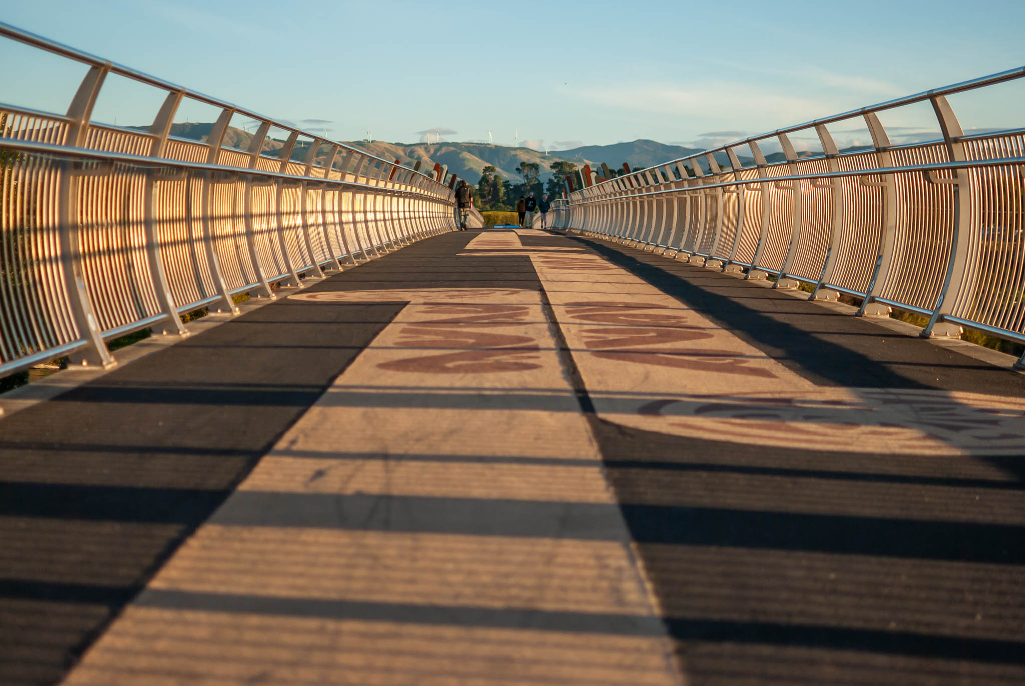 A shot of a brige with people in the distance