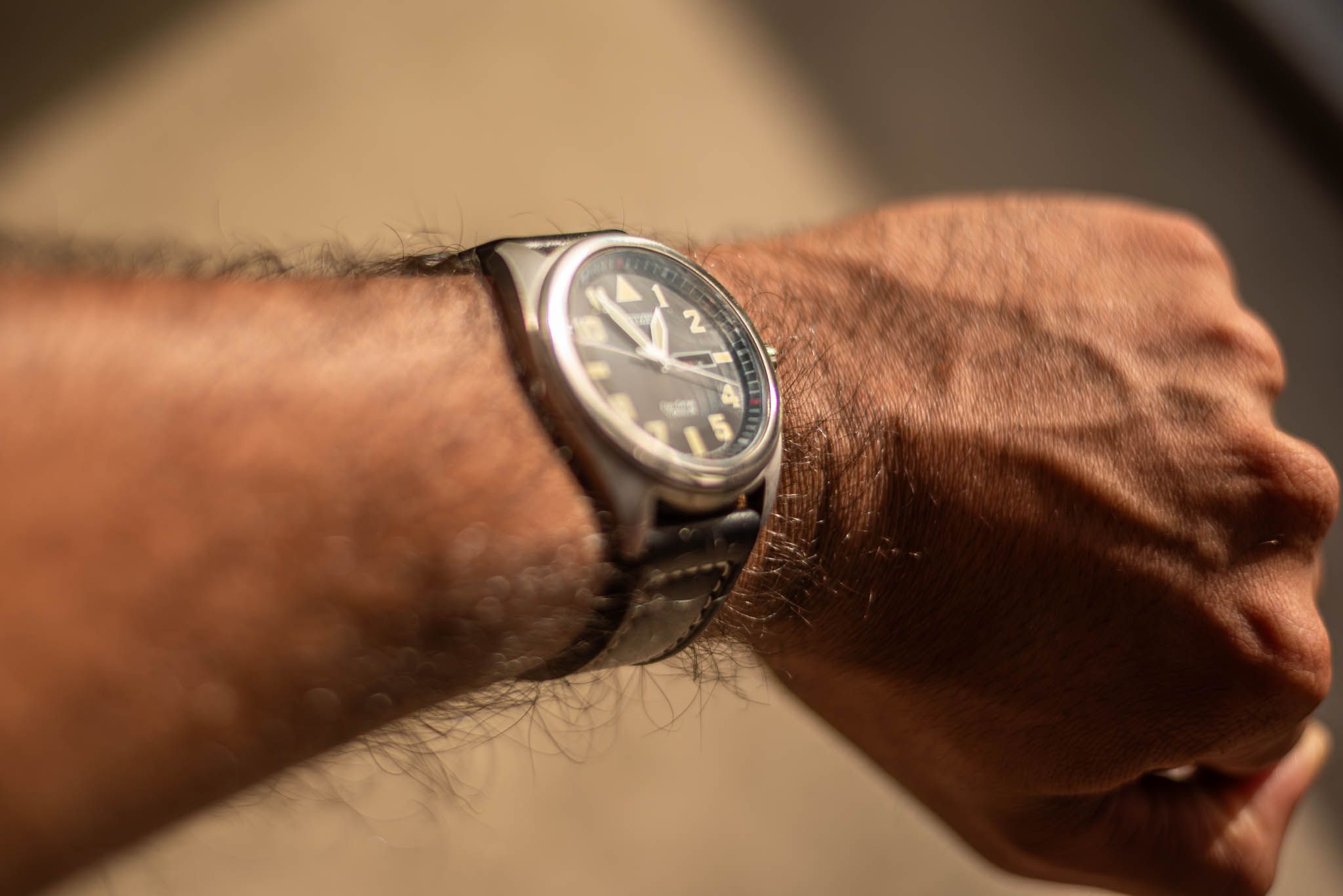 An analogue watch on a person's wrist
