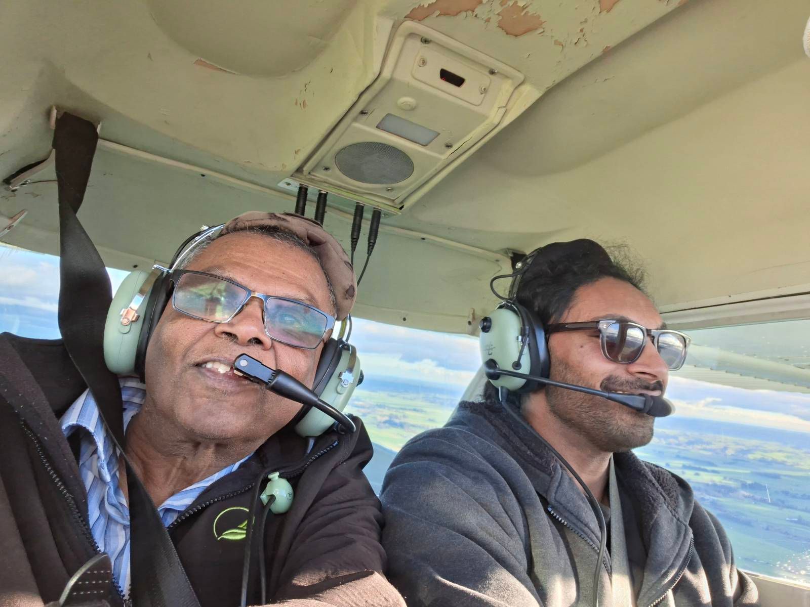Selfie with two people in a plane